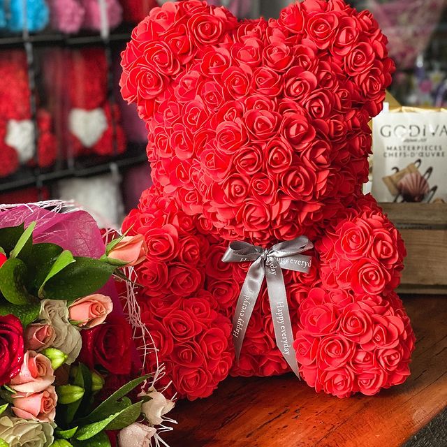 Red flower hot sale teddy bear